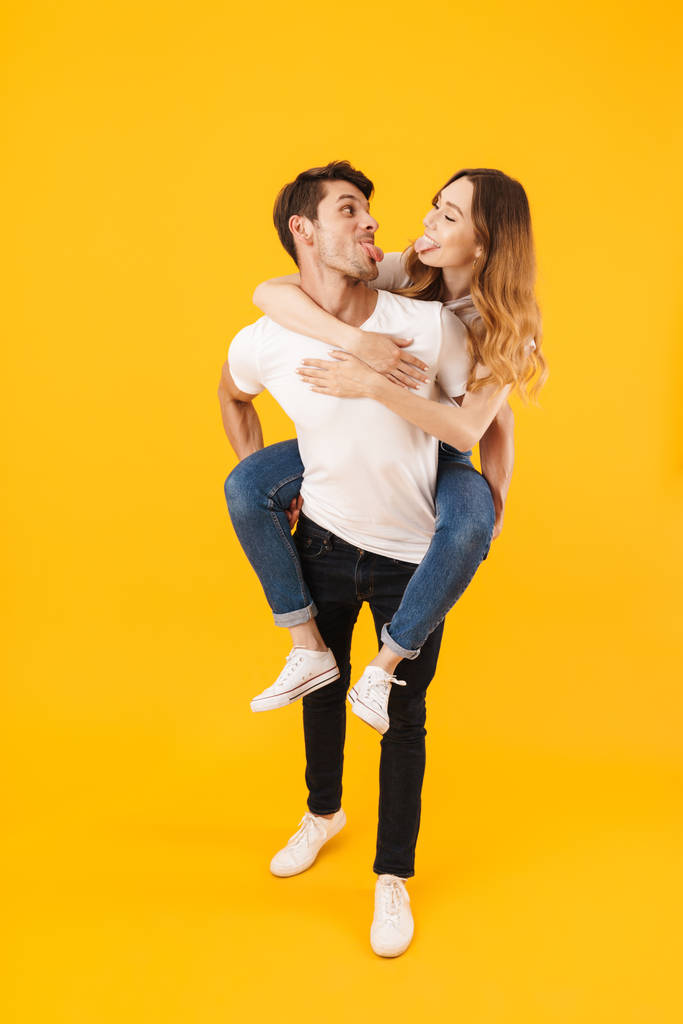 Full length portrait of funny couple man and woman in basic t-sh - Photo, Image