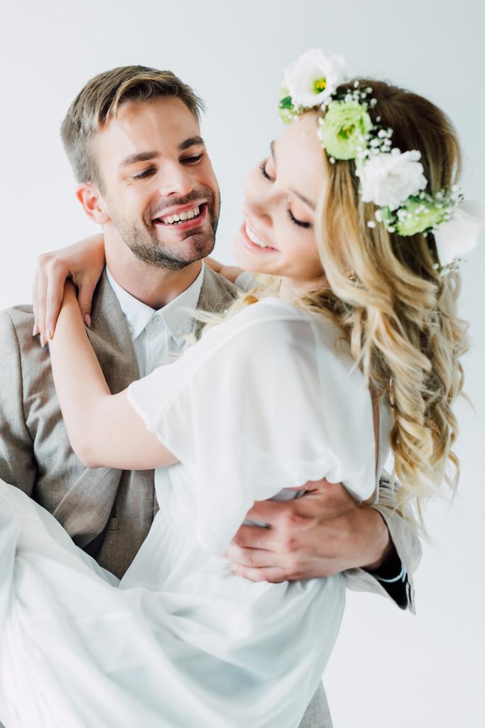 attractive bride and handsome bridegroom hugging with closed eyes  - Photo, Image