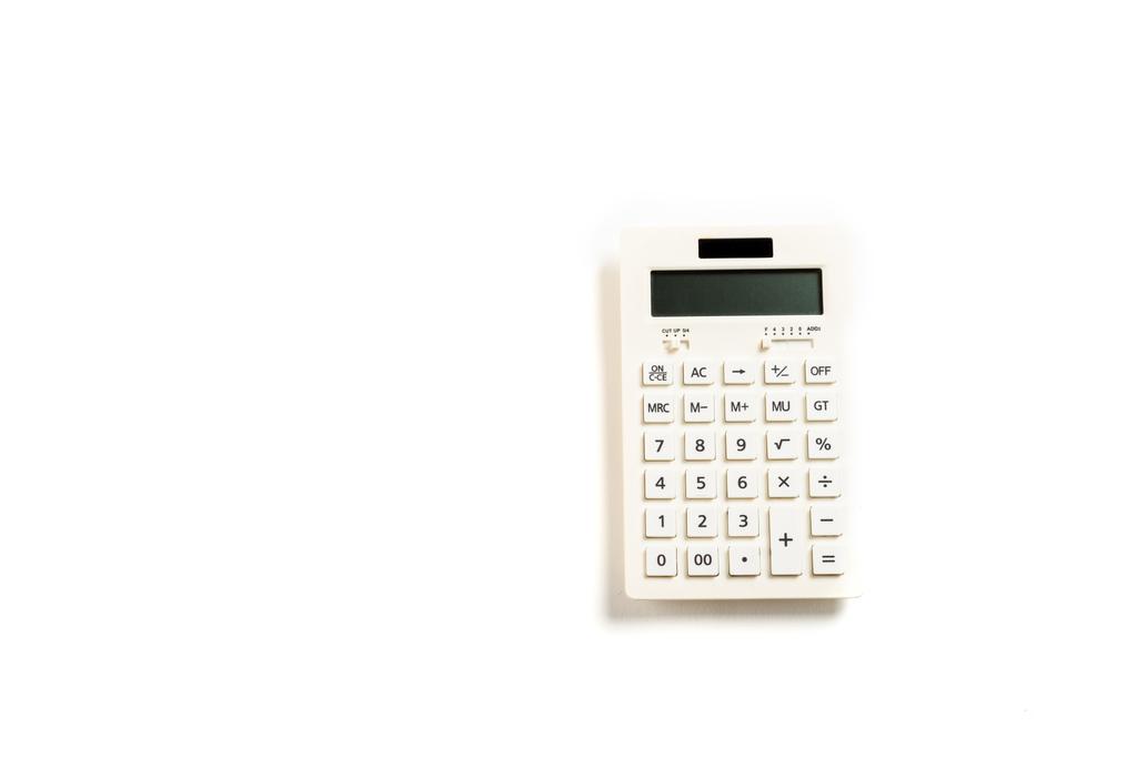 Widok z góry na nowoczesny Kalkulator z przyciskami na białym  - Zdjęcie, obraz