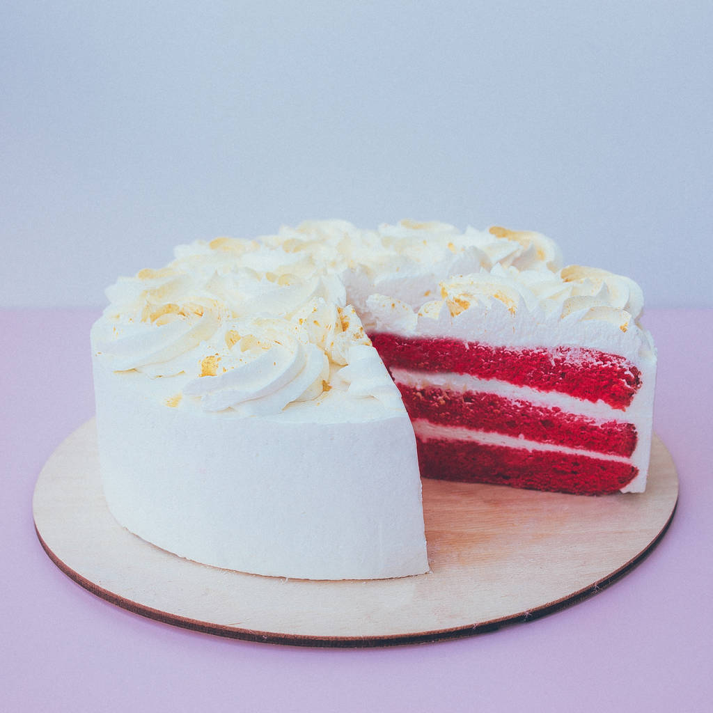 a cut of cake with whipped cream on the table background. - Photo, Image
