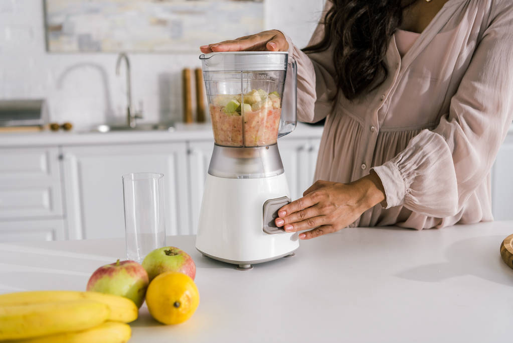 cropped view of pregnant woman preparing smoothie in blender  - Photo, Image