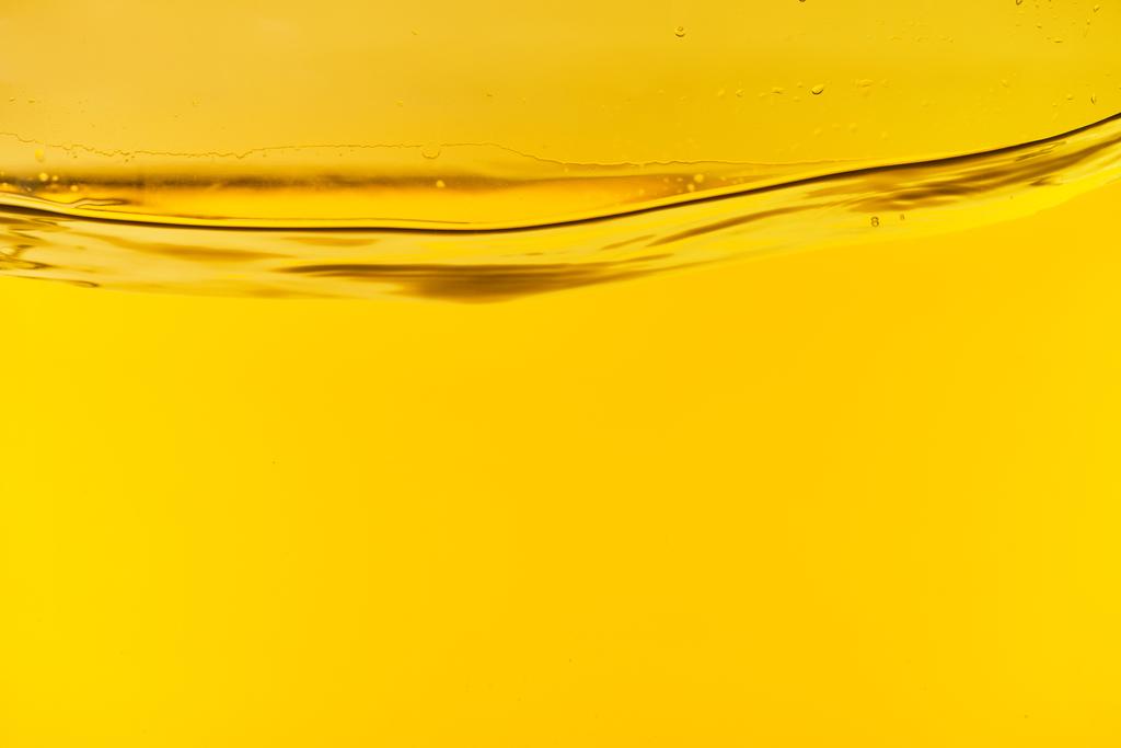 wavy clear fresh water on yellow bright background - Photo, Image