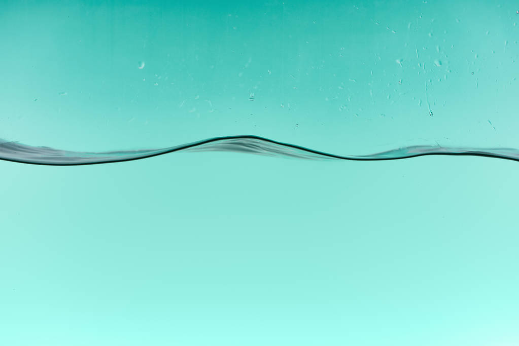 滴とターコイズの背景に波状の透明な水 - 写真・画像