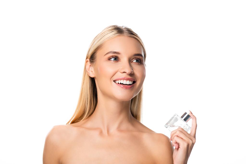 ξανθιά γυμνή χαρούμενη γυναίκα με άρωμα που κοιτάζει μακριά απομονωμένη σε λευκό - Φωτογραφία, εικόνα