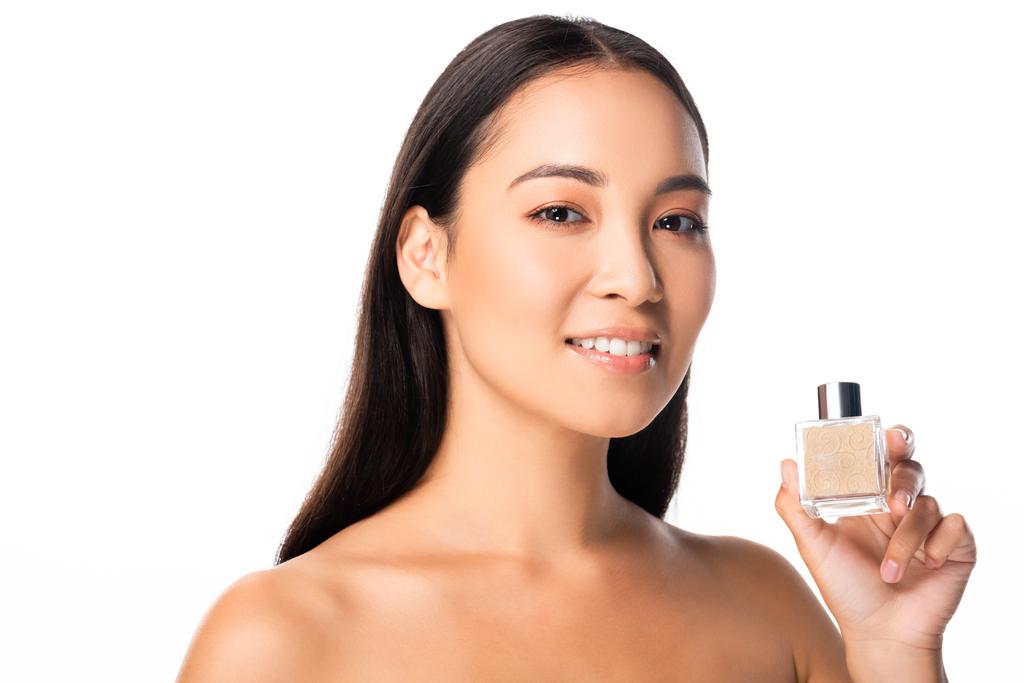 naakte Aziatische vrouw houdt parfum geïsoleerd op wit - Foto, afbeelding