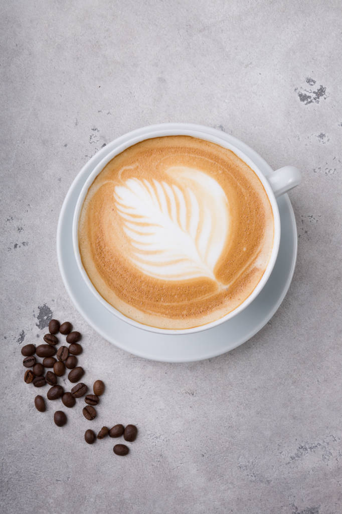 Cappuccino koffie kopje op tafel - Foto, afbeelding