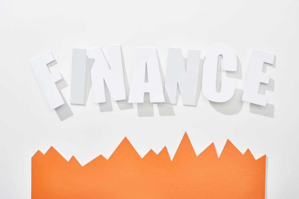 top view of finance inscription with orange statistic graph on white background - Photo, Image