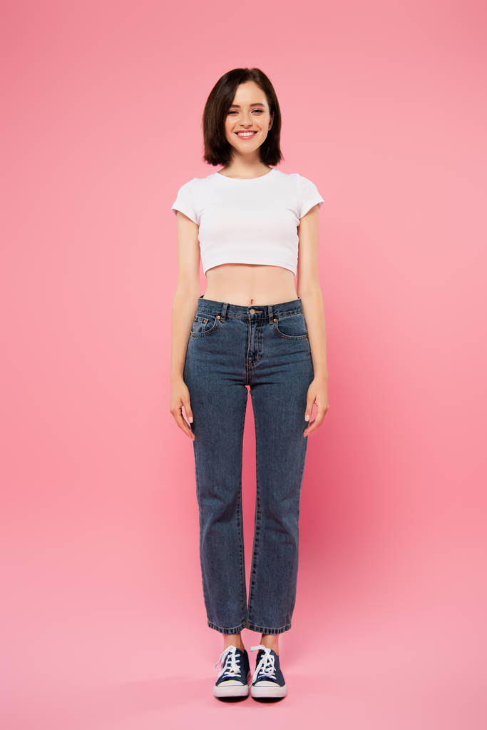 full length view of beautiful smiling girl isolated on pink - Photo, Image