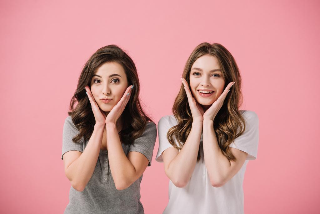 attractive and smiling women in t-shirts looking at camera isolated on pink - Photo, Image