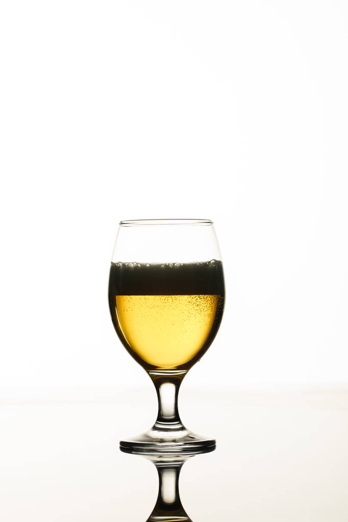 glass of beer with foam and back light isolated on white - Photo, Image