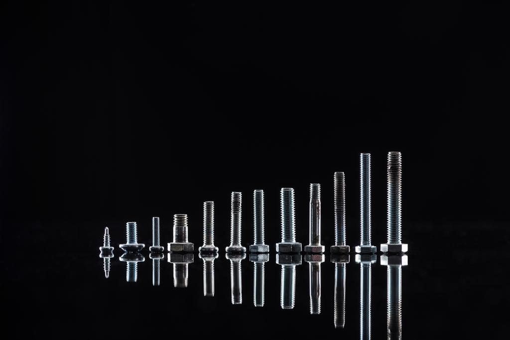 new shiny metallic bolts isolated on black - Photo, Image