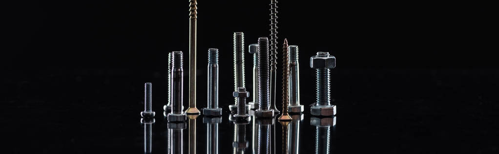 panoramic shot of various metallic screws isolated on black with copy space - Photo, Image
