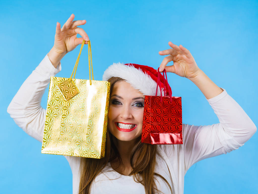 Feliz Natal mulher prende presentes saco
 - Foto, Imagem
