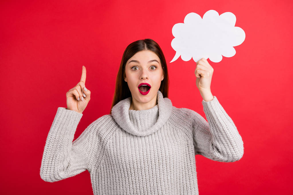 Funny lady with paper mind cloud in hand have perfect idea wear knitted jumper isolated red background - Photo, Image