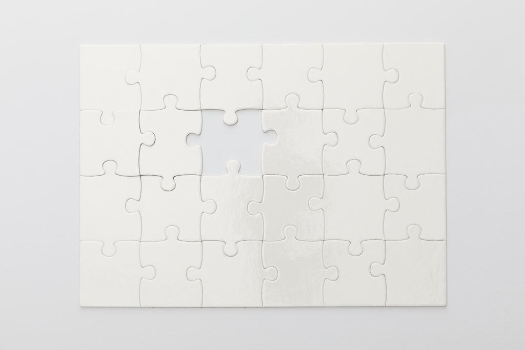 top view of completed jigsaw puzzle without one piece on white background - Photo, Image