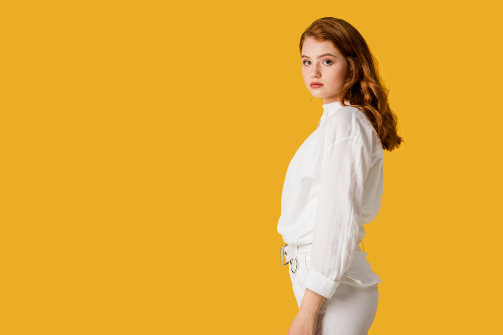 pretty and young redhead woman isolated on orange  - Photo, Image
