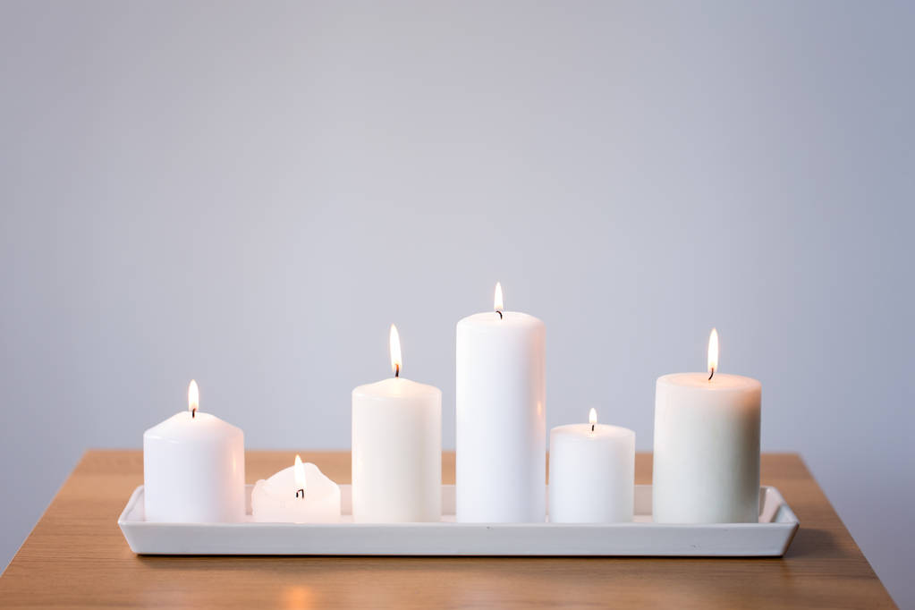 burning white candles on tray on table - Photo, Image