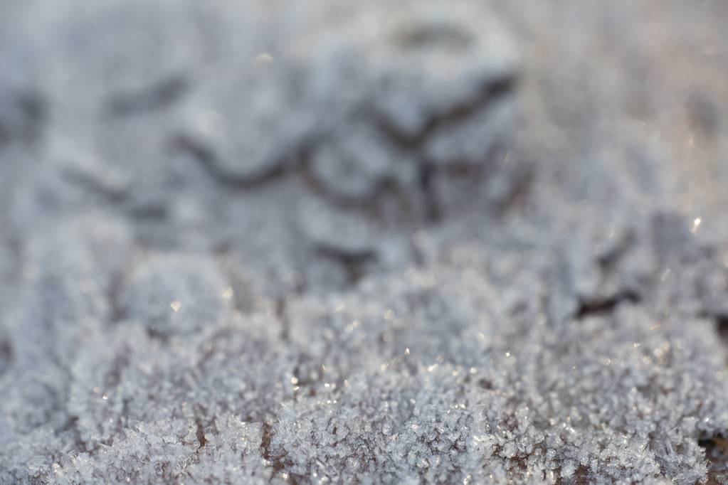 Een close-up selectief shot van het grijze zand met een wazige achtergrond - Foto, afbeelding