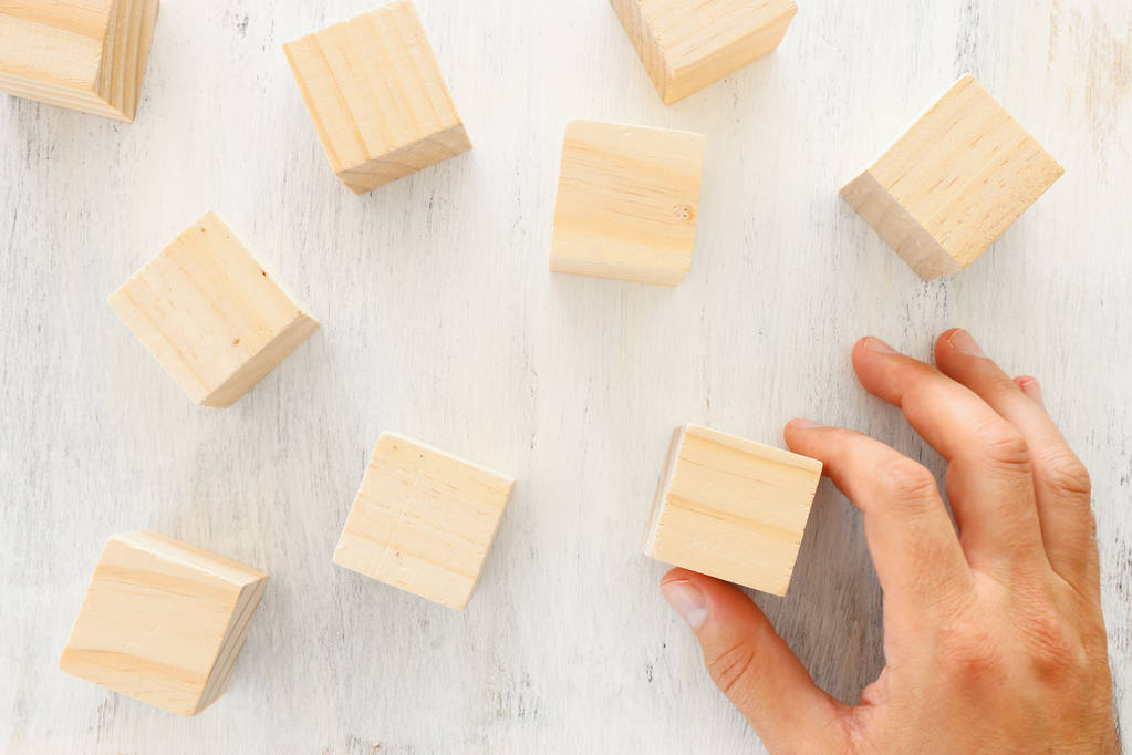 business concept of man hand arranging wooden blocks. mock up or template - Photo, Image