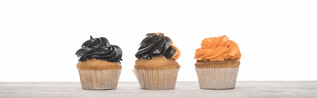 delicious Halloween orange and black cupcakes isolated on white, panoramic shot - Photo, Image