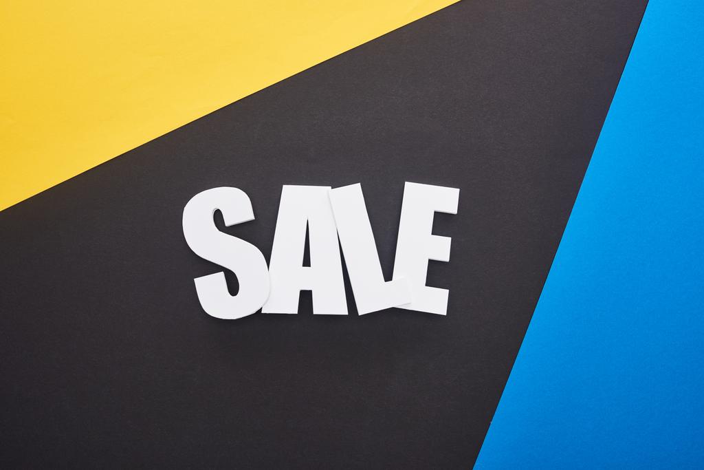 felső nézet eladó felirat kék, sárga és fekete háttér - Fotó, kép