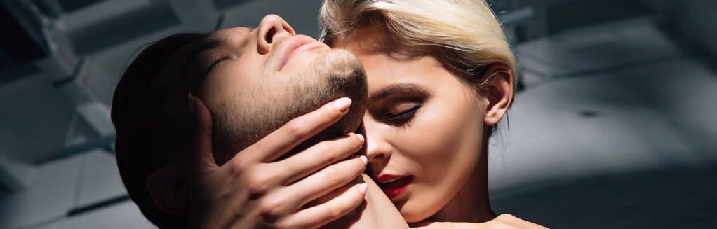 panoramic shot of attractive woman with red lips kissing man  - Photo, Image