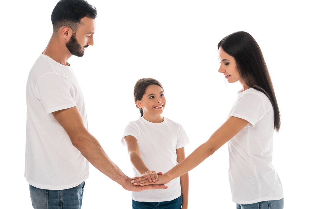 smiling family putting hands together isolated on white  - Photo, Image