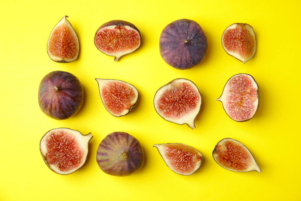 Tasty fresh fig fruits on yellow background, flat lay - Photo, Image