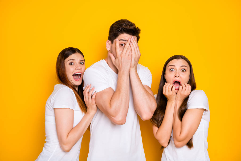 Portrait of three nice attractive nervous devastated frustrated person expressing fear sorrow disgust crying hiding shouting isolated over bright vivid shine yellow background - Photo, Image