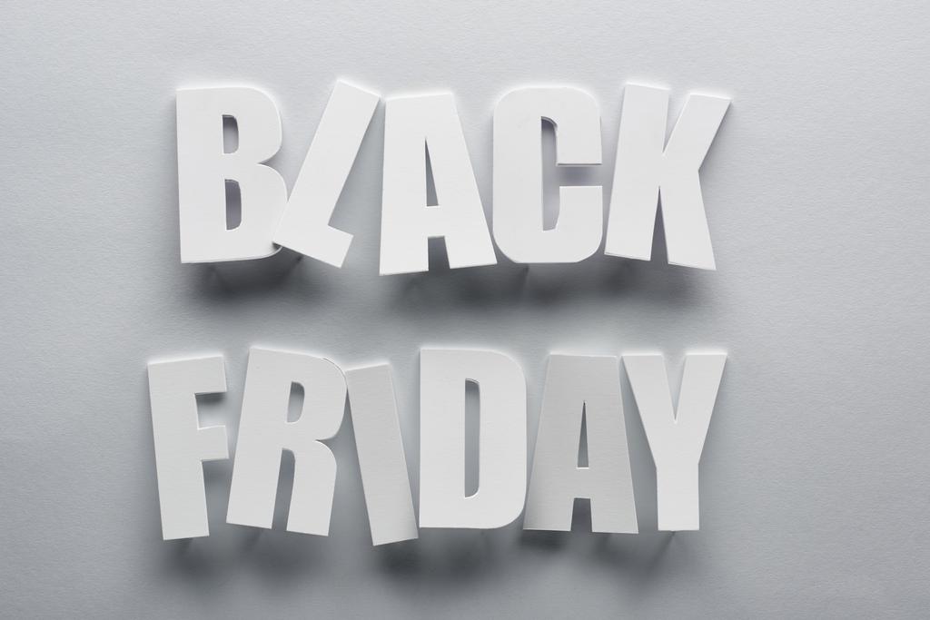 top view of black Friday lettering on grey background - Photo, Image