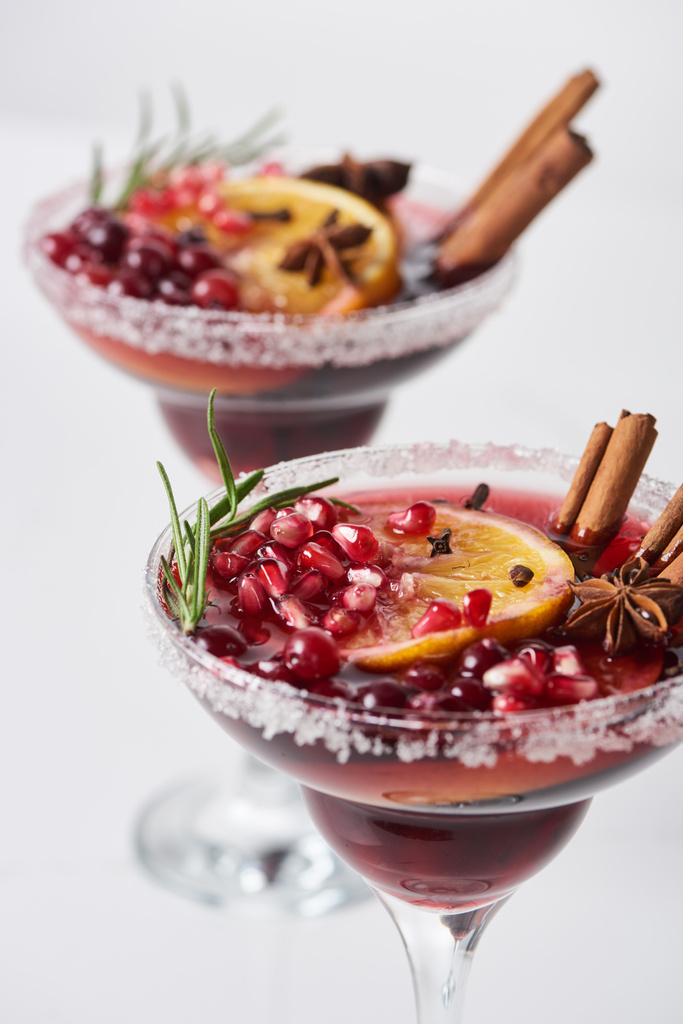 selective focus of christmas cocktail with orange, pomegranate, cinnamon - Photo, Image