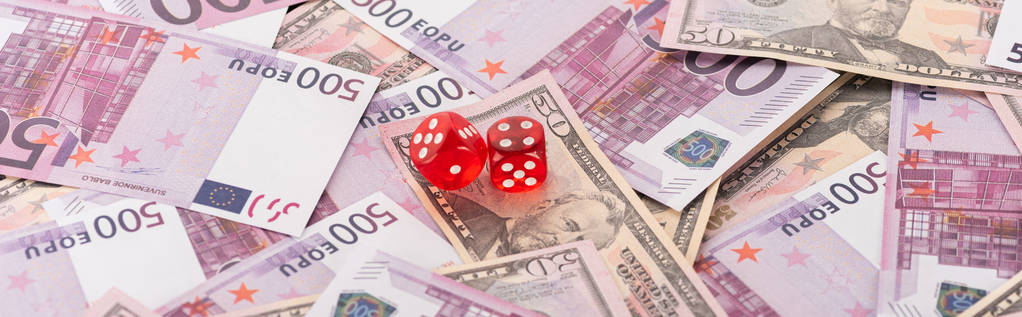 panoramic shot of dice on euro and dollar banknotes, sports betting concept - Photo, Image