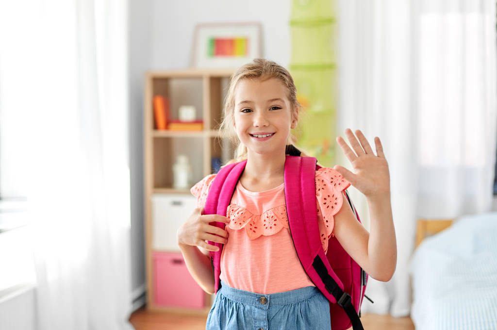 student girl with school bag at home waving hand - Photo, Image
