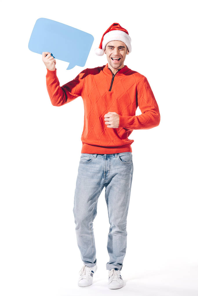 усміхнений чоловік у капелюсі Санта тримає блакитну порожню мислення бульбашку, ізольовано на білому
 - Фото, зображення