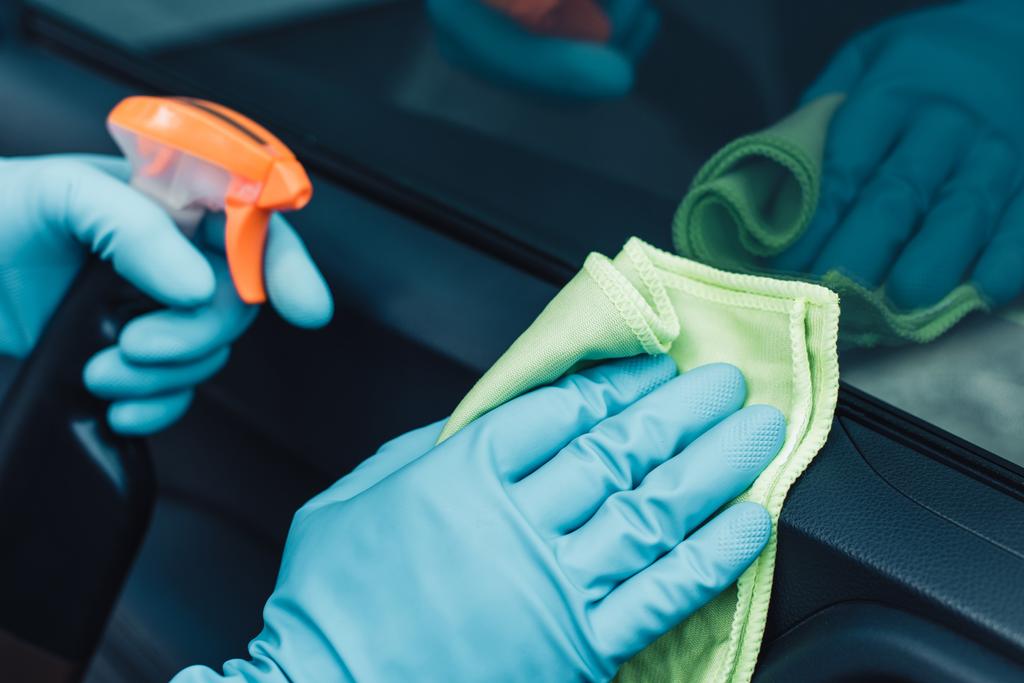 partial view of car cleaner in rubber gloves cleaning car with rag - Photo, Image