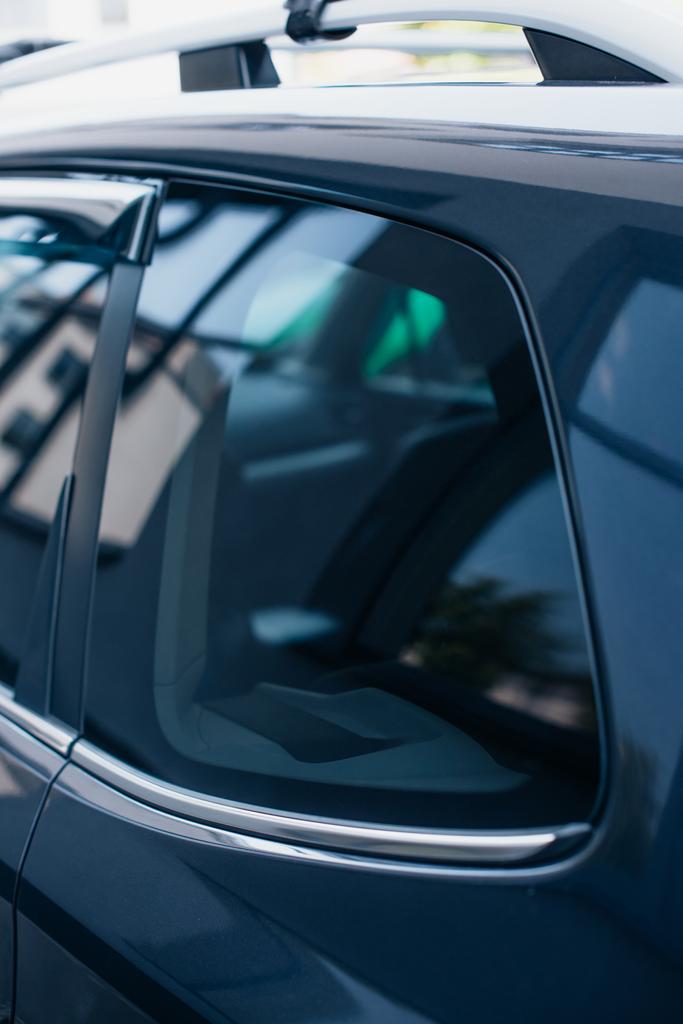side window of black, modern polished car with reflection - Photo, Image