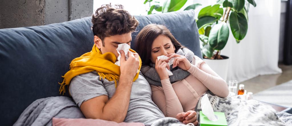 panoramic shot of sick girlfriend and boyfriend sneezing and holding napkins - Photo, Image