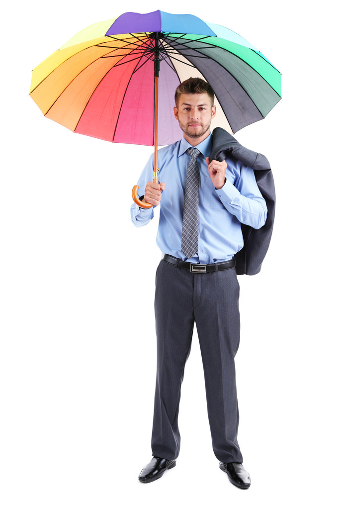 zakenman met multicolor paraplu, geïsoleerd op wit - Foto, afbeelding
