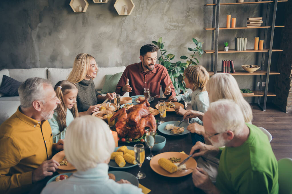 Portrait of nice charming cheerful big full family company group brother sister talking meeting gathering eating domestic meal dishes brunch gratefulness modern loft industrial style interior house - Photo, Image