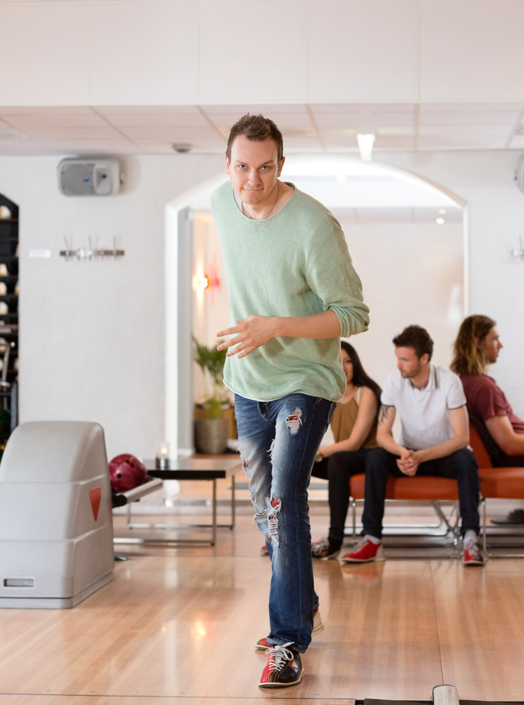 Young Man Bowling in Club - Photo, Image