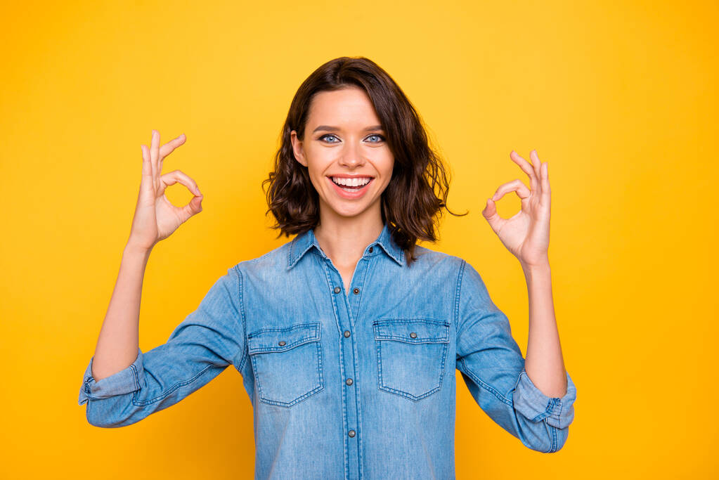 Portrait of cheerful lovely promoter show okay signs select novelty suggest ads advertise promo wear modern fashionable clothes isolated over bright color background - Photo, Image