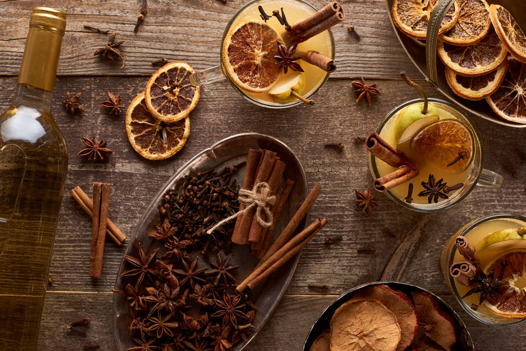 top view of traditional pear mulled wine and spices on wooden rustic table  - Photo, Image