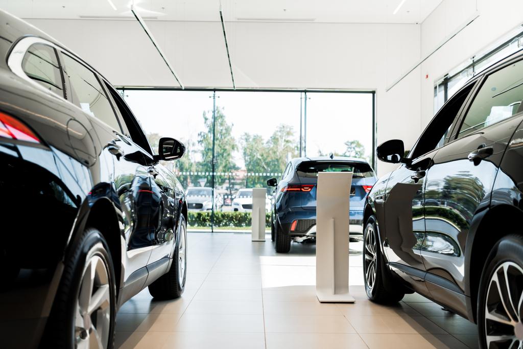 selective focus of black luxury cars in car showroom  - Photo, Image