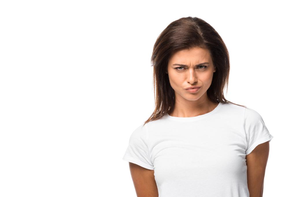 thoughtful woman in white t-shirt looking at camera, isolated on white - Photo, Image