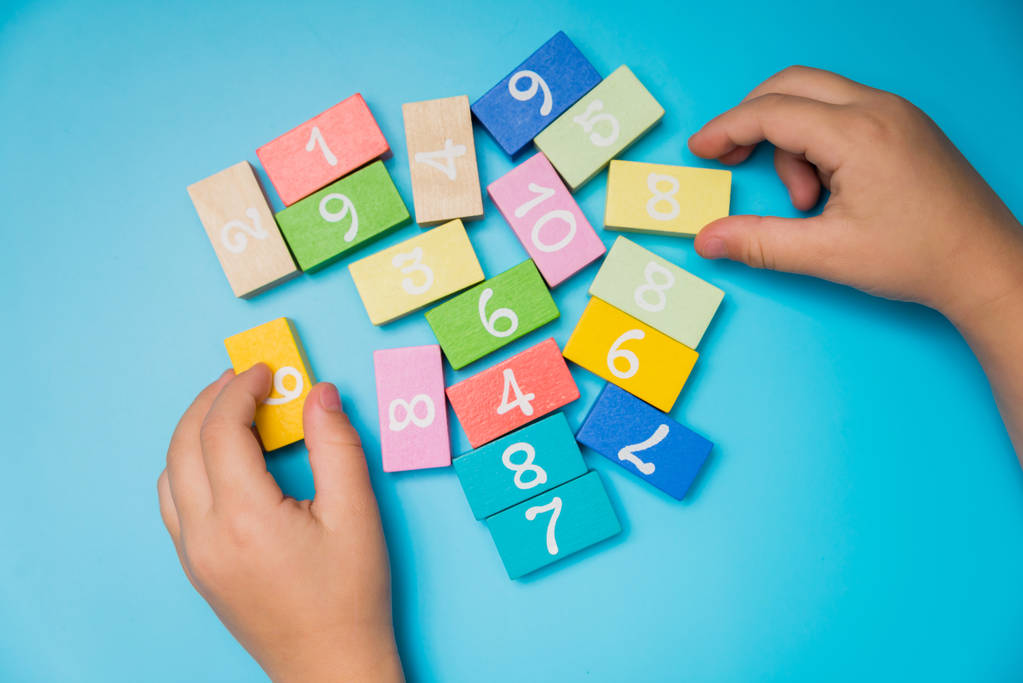 colored cubes with numbers hands - Photo, Image