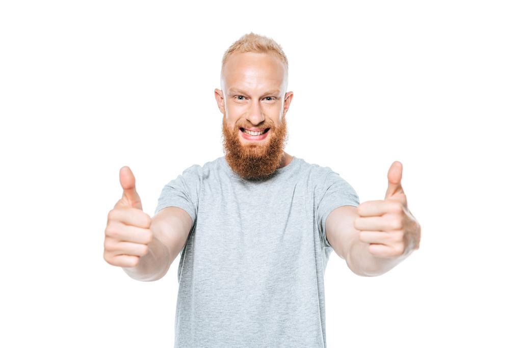 красивий усміхнений чоловік у сірій футболці, що показує великі пальці вгору, ізольований на білому
 - Фото, зображення