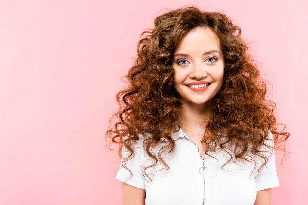 beautiful smiling curly girl, isolated on pink - 写真・画像