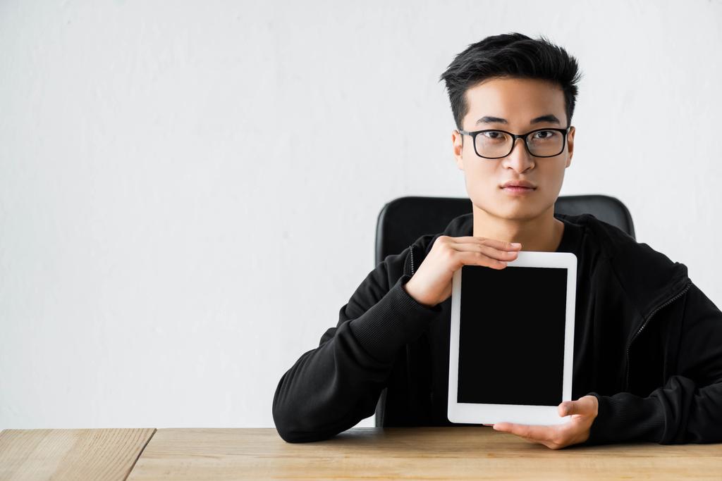 asian hacker holding digital tablet with copy space - Photo, Image