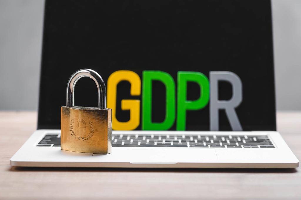 selective focus of metal padlock and gdpr letters on laptop  - Photo, Image
