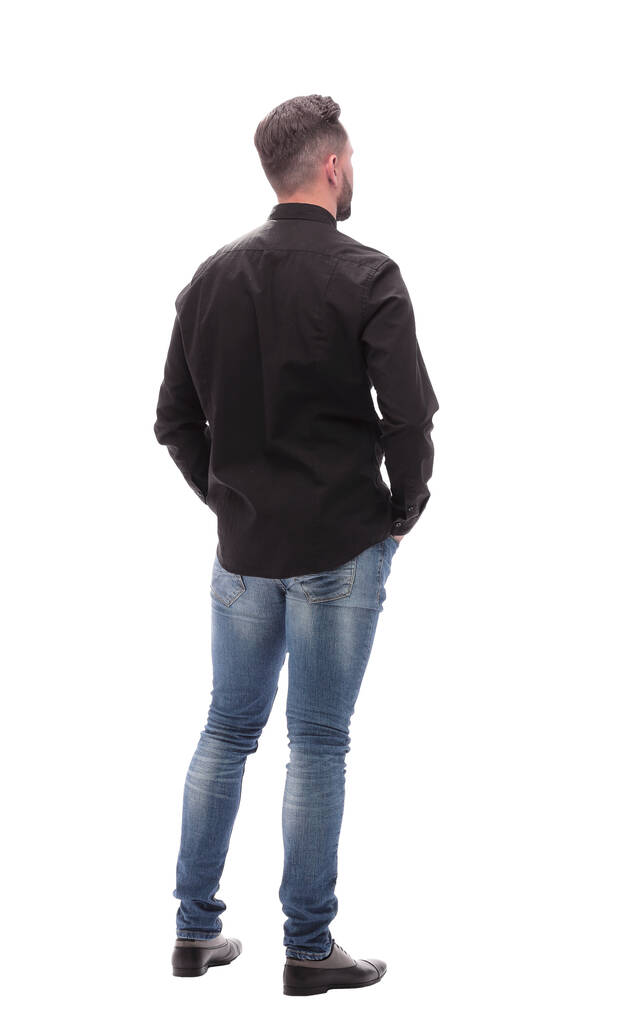 вид сзади. молодой человек в джинсах с нетерпением ждет
 - Фото, изображение
